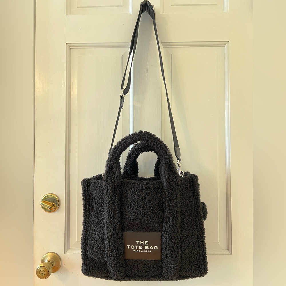 Marc Jacob’s The Tote Bag in teddy, size medium, black color, with strap.